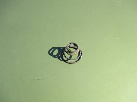 Window crank/interior door handle spring